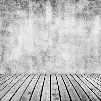 Empty interior background with white grunge concrete wall and wooden floor