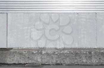Abstract urban outdoor background interior with shining metal panels on the wall