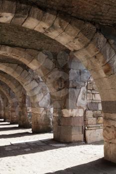 Empty stone gallery with arcs and columns. Ruins of Ancient city Smyrna. Izmir, Turkey
