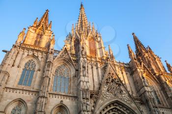 Cathedral of the Holy Cross and Saint Eulalia also known as Barcelona Cathedral. Facade fragment in warm evening sunlight