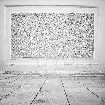 Abstract empty white interior background, stone floor tiling and decorative wall