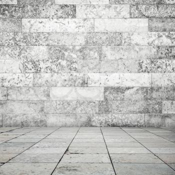 Abstract empty interior background, stone floor tiling and white decorative wall