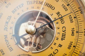 Closeup photo of vintage yellow Russian barometer 