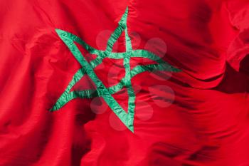 Waving National flag of Morocco. Green star on red background