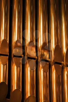 Shining organ tubes close up vertical photo