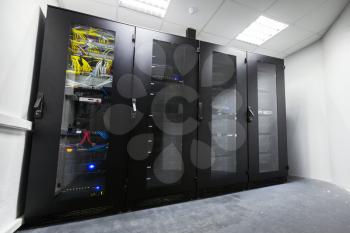 Modern server room interior with black metal computer cabinets