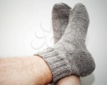 Closeup photo of male feet with woolen socks 