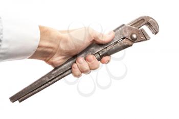 Old rusted steel screw wrench in male hand isolated on white background