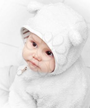 little baby in white bear costume on white background