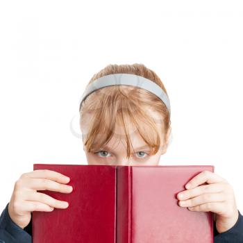 Closeup portrait of blond Caucasian schoolgirl with red book isolated on white 
