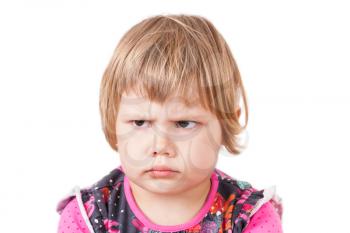 Cute small Caucasian blond baby girl angry frowns, studio portrait isolated on white background