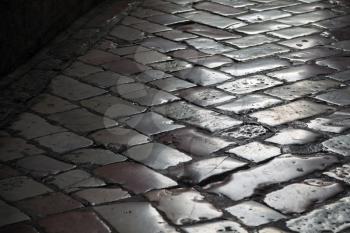 Old shining stone pavement surface background