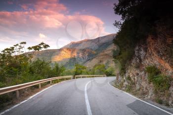 Montenegro, right turn on mountain highway in early morning light