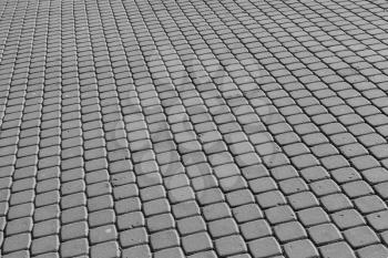 Background texture of modern gray cobblestone pavement surface