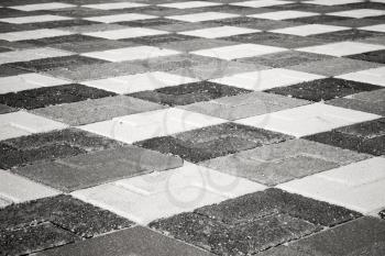 Black and white pattern of urban roadside pavement