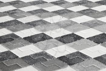 Black gray and white pattern of urban roadside pavement