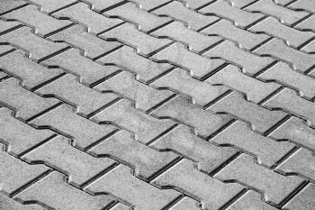 Abstract background texture of modern gray cobblestone road pavement
