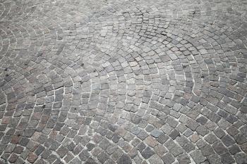 Granite cobblestone road pavement. Background photo texture