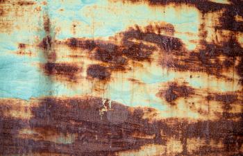 Rusted blue-green painted metal wall. Detailed photo texture