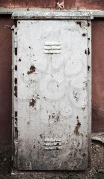 Old metal door texture with gray cracked painting