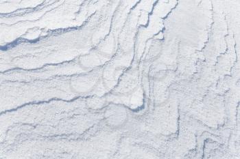 Abstract background texture of snowdrift with nice curved shadows