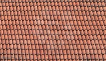 Old red slate tiles roof background texture