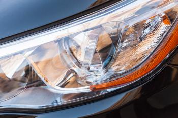 Modern shining car headlight with LED lamps, closeup photo with selective focus