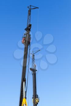Construction industry equipment, machines for drilling wells and the installation of piles