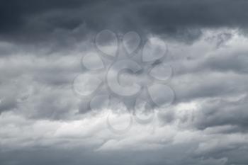 Dark sky with blue gray stormy clouds, natural sky background photo texture
