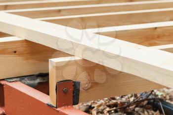 Fragment of wooden flooring under construction, abstract rural architecture background