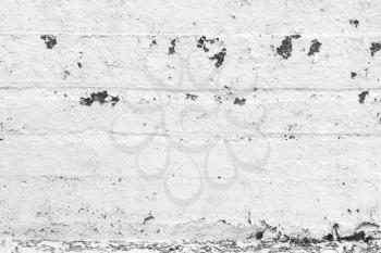 Background texture of white grungy concrete wall with damaged plastering layer