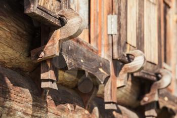 Wooden shutters latch. Traditional rural Russian architecture details. Closeup photo with selective focus