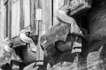 Wooden shutters latch. Traditional rural Russian architectural details. Close up black and white photo with selective focus