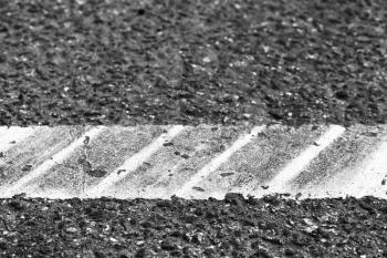 White line with tire tracks over it, highway road marking fragment. Abstract transportation background