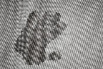 Wet handprint on gray frozen fabric surface