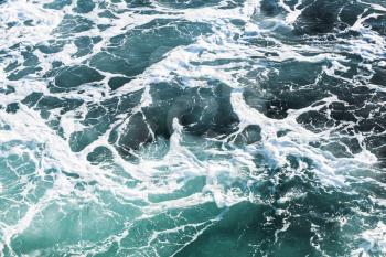 Stormy sea water surface with foam and waves, natural background photo