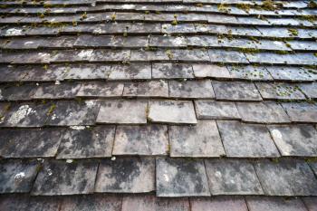 Old stone roof tiling, photo background with selective focus