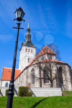 Old street lamp near Niguliste or St. Nicholas Church in Tallinn, Estonia. Vertical photo