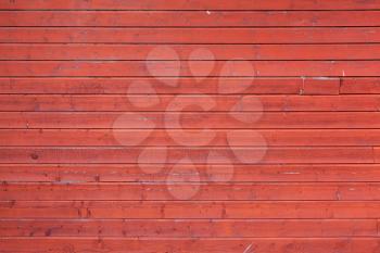 Red rural wooden wall, close-up background photo texture