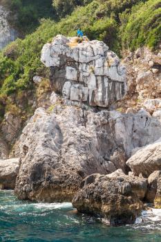 Vertical coastal landscape with rocks. Capri island, Mediterranean Sea, Italy