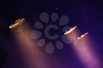 Scenic spot lights with purple rays in the dark, stage illumination equipment