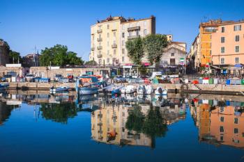 Small wooden fishing boats moored in old port of Ajaccio, Corsica island, France