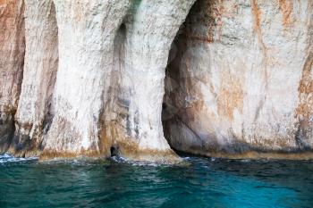 Coastal rocks of Greek island Zakynthos with caves and stone arches