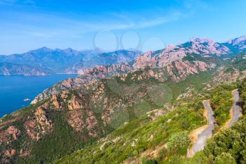 Rocks and sea in summer. Coastal landscape of French mountainous Mediterranean island Corsica. Corse-du-Sud, Piana region