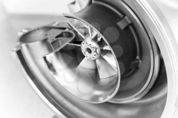 Turbocharger structure with cross section, close up black and white photo with soft selective focus