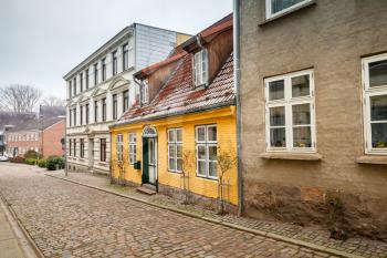 Traditional living houses along the street in old town of Flensburg city, Germany