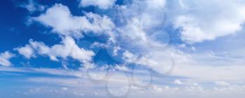 Clouds over blue sky in summer day, panoramic background photo texture