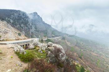 Crimea peninsula, Black Sea. Coastal road, landscape of Laspi district in foggy spring cloudy day
