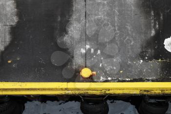 Ships mooring equipment, yellow port bollard on concrete pier, top view