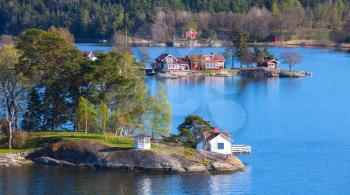 Swedish rural landscape, coastal village with wooden houses on islands